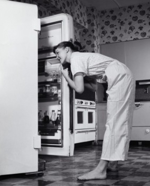 Side profile of a young woman looking in a refrigerator Poster Print - Item # VARSAL2559315