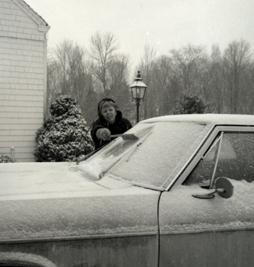 Woman cleaning car from snow Poster Print - Item # VARSAL255416500