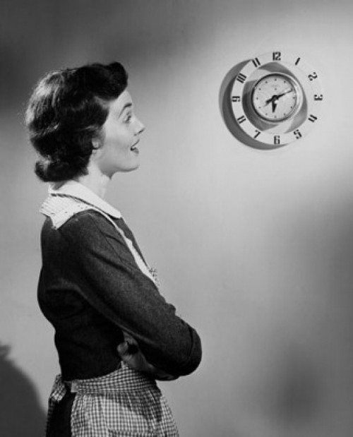 Side profile of young woman looking at clock Poster Print - Item # VARSAL25527184