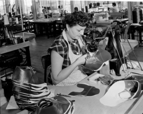 Woman in factory sewing shoe Poster Print - Item # VARSAL255416680