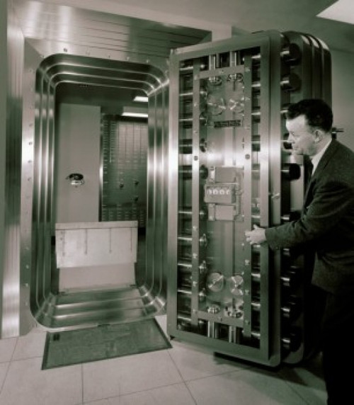 Side profile of a mature man opening a bank vault door Poster Print - Item # VARSAL2554360