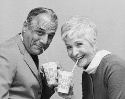 Portrait of a senior couple drinking from disposable cups Poster Print - Item # VARSAL25548861