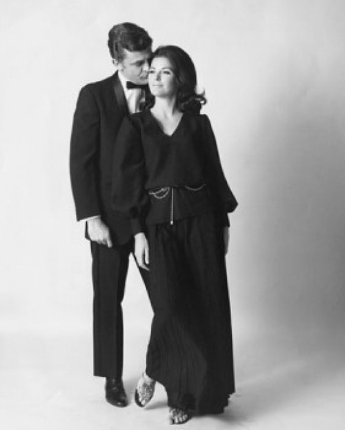 Young man kissing a young woman on the cheek Poster Print - Item # VARSAL25523475