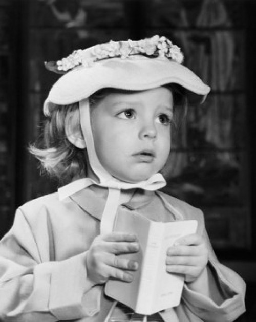 Close-up of girl holding book in church Poster Print - Item # VARSAL2553309