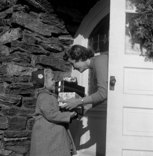 Girl giving Christmas gifts Poster Print - Item # VARSAL255416462