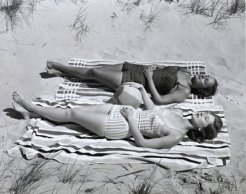 High angle view of two young women sunbathing on beach Poster Print - Item # VARSAL2556542