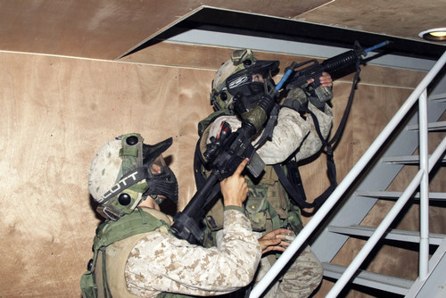 Infantry scouts go up a flight of stairs Poster Print
