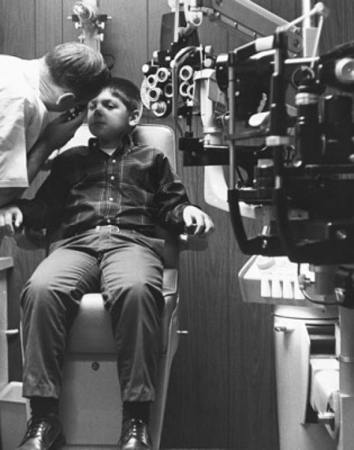 Optometrist examining a boy's eye Poster Print - Item # VARSAL25516515B