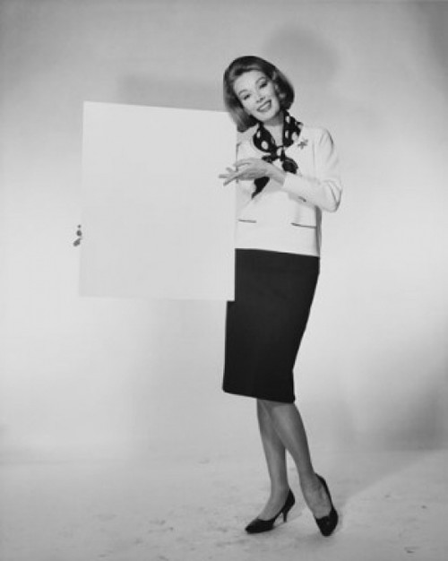 Portrait of a young woman holding a blank placard Poster Print - Item # VARSAL25541946