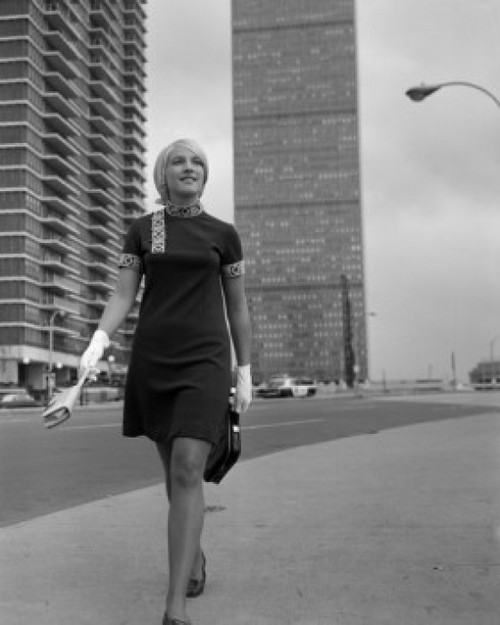 Young woman walking in street Poster Print - Item # VARSAL255422723