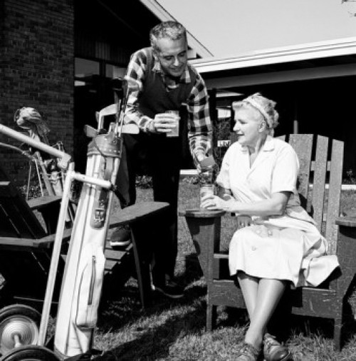 Mid adult man and mother having break from playing golf Poster Print - Item # VARSAL255417139