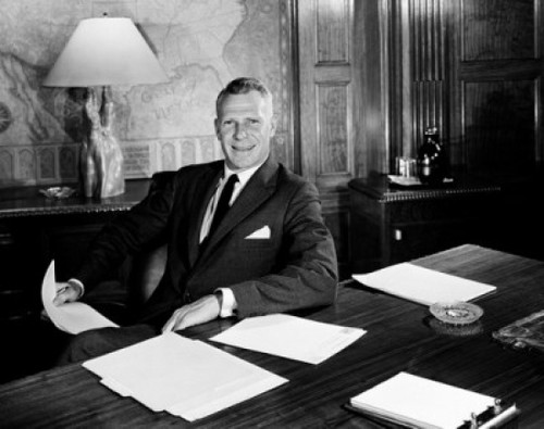 Businessman at desk holding documents Poster Print - Item # VARSAL2556751