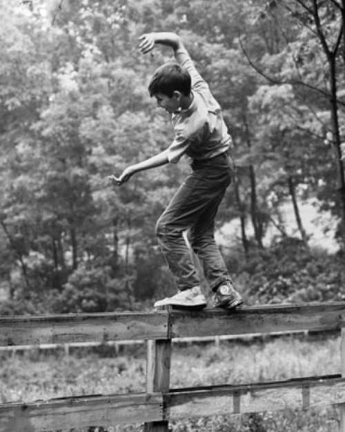 Side profile of a boy walking on a fence Poster Print - Item # VARSAL2559915