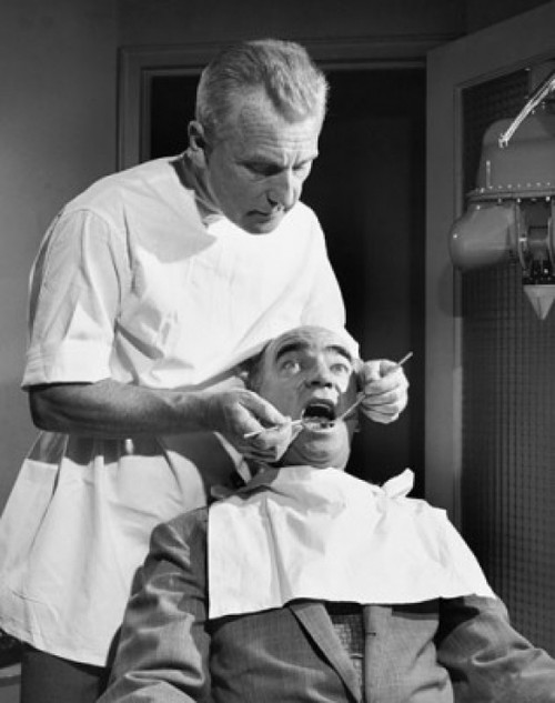 Terrified patient getting treatment from a dentist Poster Print - Item # VARSAL25526270