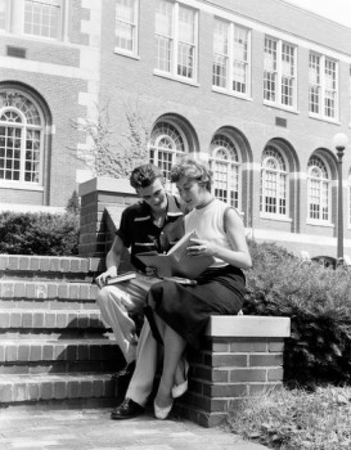 Student's couple sitting and reading book Poster Print - Item # VARSAL255419321