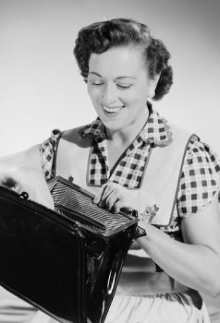 Studio portrait of mid adult woman opening purse Poster Print - Item # VARSAL255422840