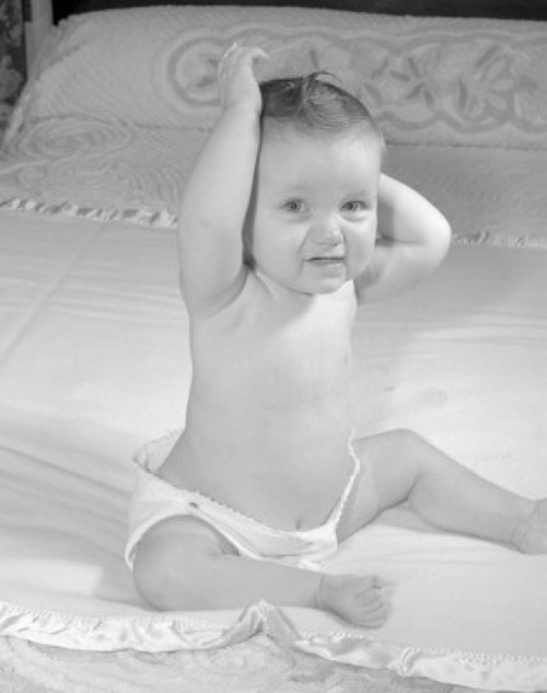 Portrait of baby sitting on bed Poster Print - Item # VARSAL255642F