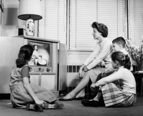 Mother with her three children watching television Poster Print - Item # VARSAL2551605