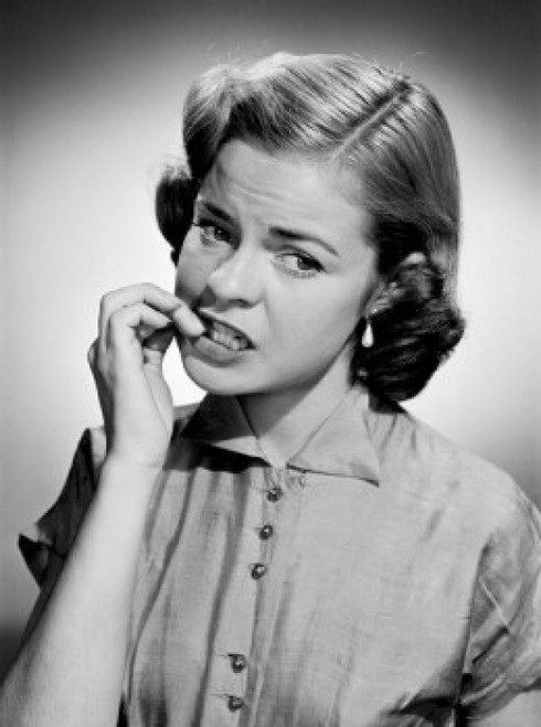Portrait of young woman biting nails Poster Print - Item # VARSAL255416714