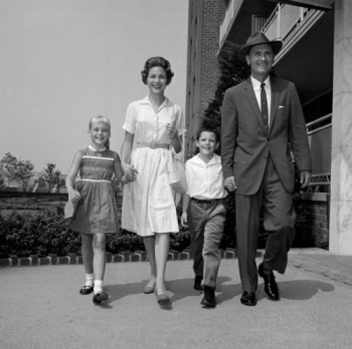Boy and girl walking with parents outside flats Poster Print - Item # VARSAL255417160B