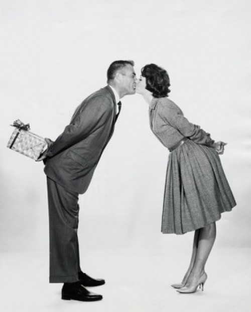 Side profile of a young couple kissing each other Poster Print - Item # VARSAL255697