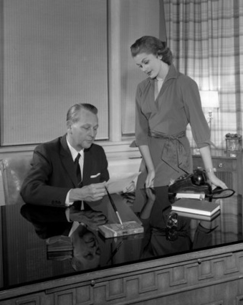 Businessman talking with secretary in office Poster Print - Item # VARSAL25528121