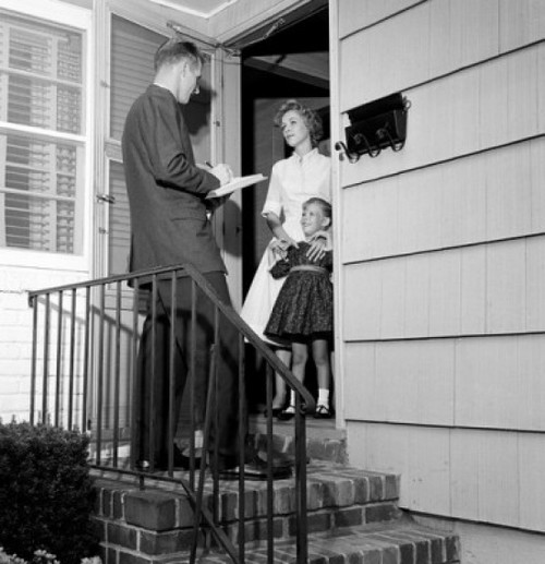 Mother and daughter answering pollster's questions in doorway Poster Print - Item # VARSAL255417554