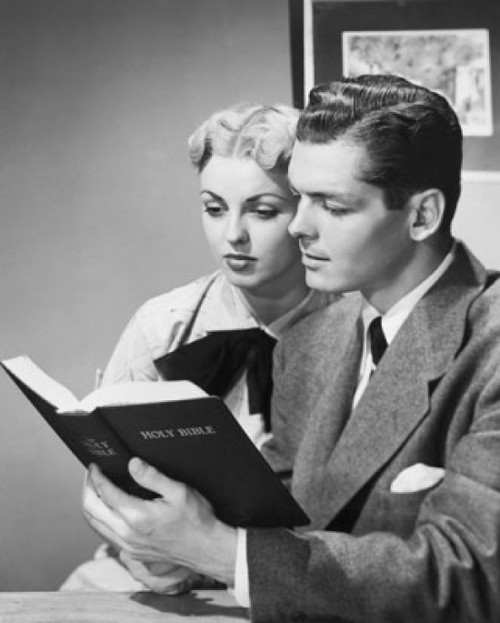 Young couple reading the Bible Poster Print
