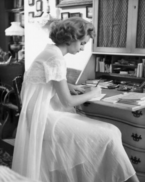 Side profile of a young woman writing a letter Poster Print - Item # VARSAL255909