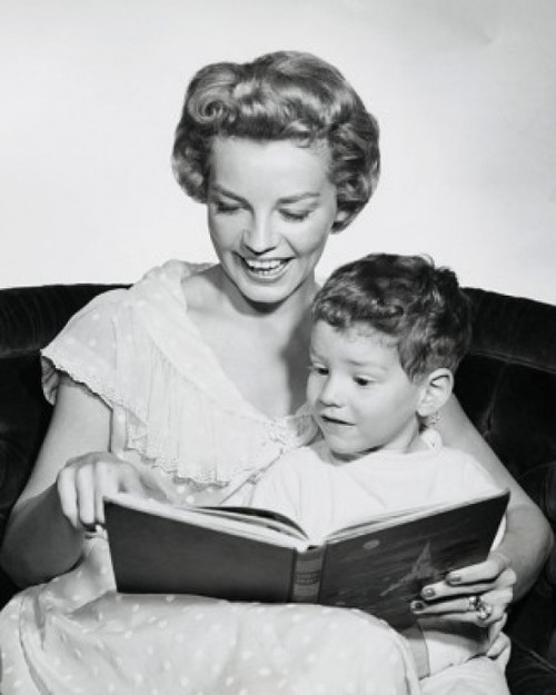 Portrait of son sitting on his mother's lap reading book Poster Print - Item # VARSAL2552462B