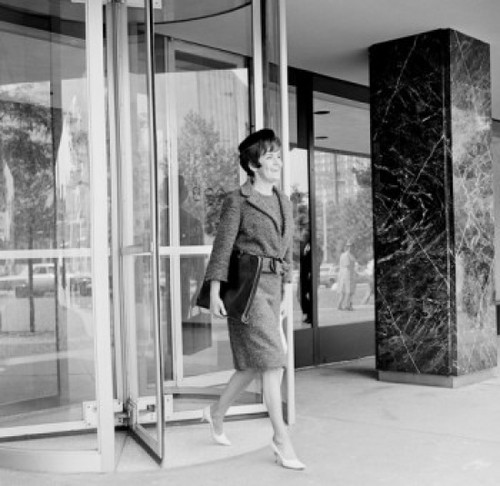 Elegant woman on street Poster Print - Item # VARSAL255421930