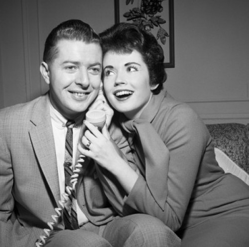 Young couple on the phone Poster Print - Item # VARSAL255418048