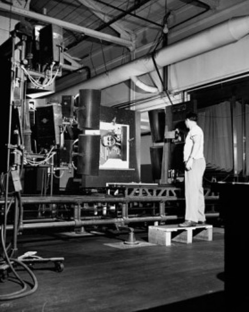 Side profile of a male worker operating a photoengraving camera Poster Print - Item # VARSAL25539117
