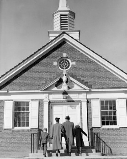 Parents with children in front of church Poster Print - Item # VARSAL255421837
