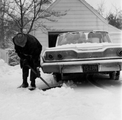 Man cleaning snow around car Poster Print - Item # VARSAL255416383