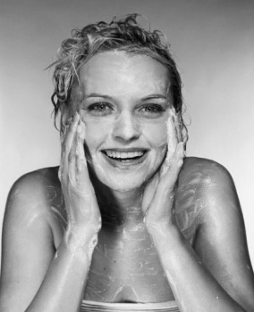 Portrait of a young woman washing her face Poster Print - Item # VARSAL25542473