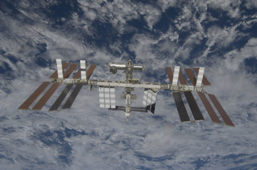 March 25, 2009 - The International Space Station, backdropped by a blue and white Earth Poster Print - Item # VARPSTSTK202579S