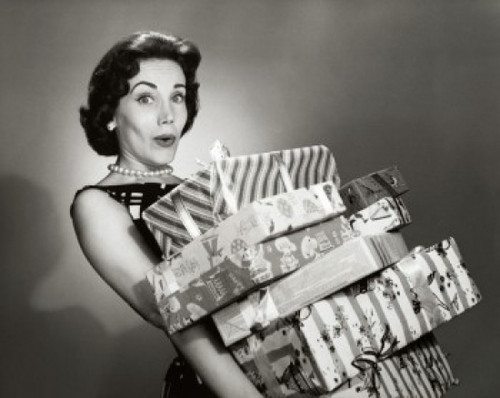 Close-up of a mid adult woman carrying a stack of gifts Poster Print - Item # VARSAL25528995