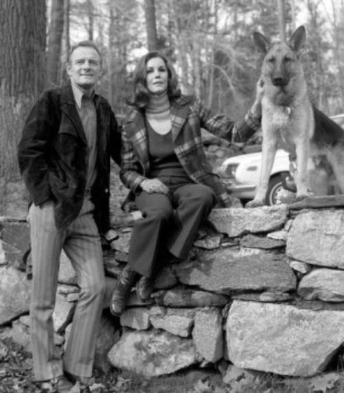 Portrait of mature couple with dog sitting on stone wall Poster Print - Item # VARSAL25549120