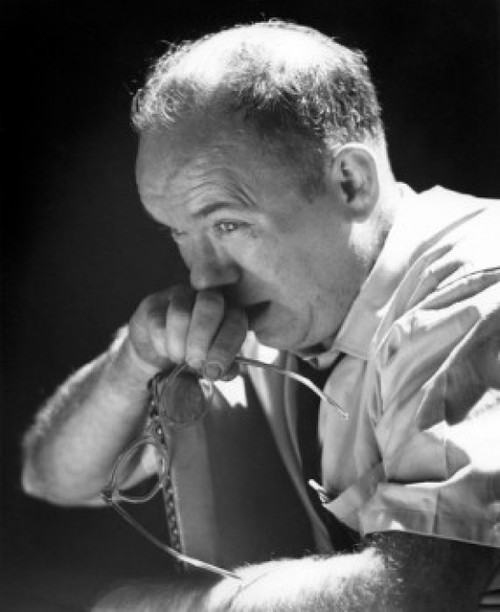 Pensive businessman holding glasses Poster Print - Item # VARSAL25512289B