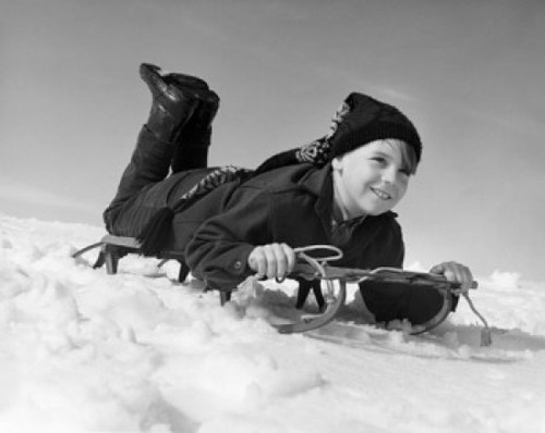 Boy sliding on a sled Poster Print - Item # VARSAL25512978B