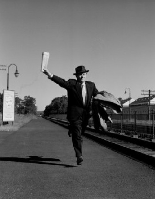Man with suitcases running along railroad track Poster Print - Item # VARSAL255422145