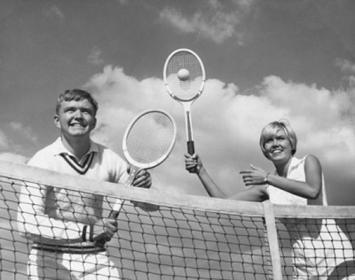 Low angle view of young couple playing tennis Poster Print - Item # VARSAL25541376