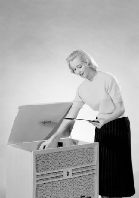 Young woman putting vinyl record to record player Poster Print - Item # VARSAL255421247 Young woman putting vinyl record to record player Poster Print - Item # VARSAL255421247