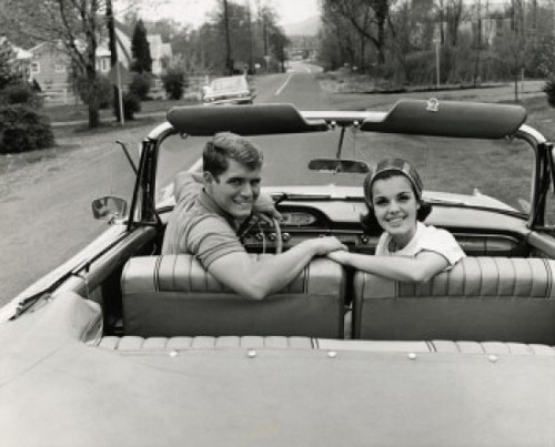 Portrait of a young couple sitting in a convertible car Poster Print - Item # VARSAL2556408B