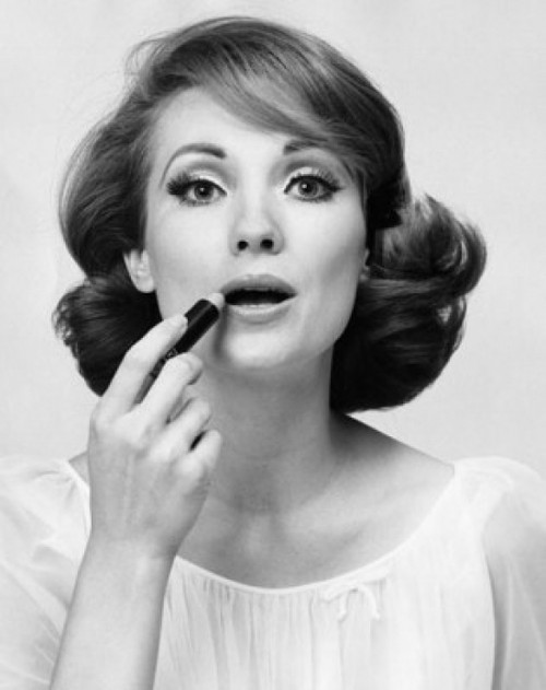 Portrait of a young woman applying lipstick Poster Print - Item # VARSAL2556048A