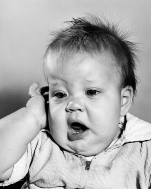 Baby touching his temple and yawning Poster Print - Item # VARSAL2559557B