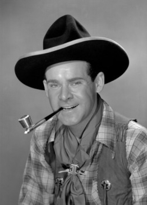 Mid adult cowboy smoking cigarette Poster Print
