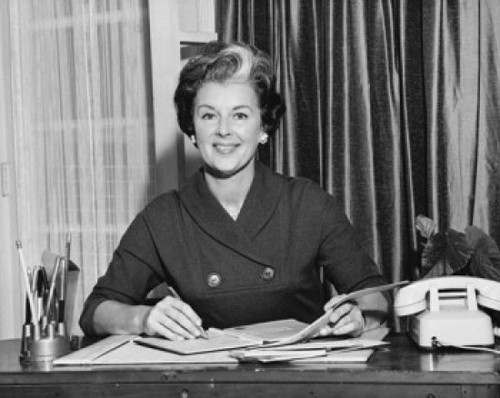 Portrait of a businesswoman working in an office and smiling Poster Print - Item # VARSAL25515948