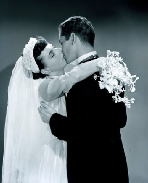 Groom kissing bride holding bouquet Poster Print - Item # VARSAL255417259